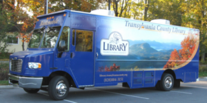 https://library.transylvaniacounty.org/wp-content/uploads/2022/07/bookmobile-1-e1658519509461-300x150.png