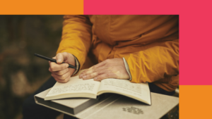 person writing in a journal
